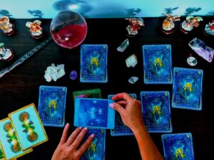 A person performing a tarot card reading Tarot/Oracle/Angel Card Reading